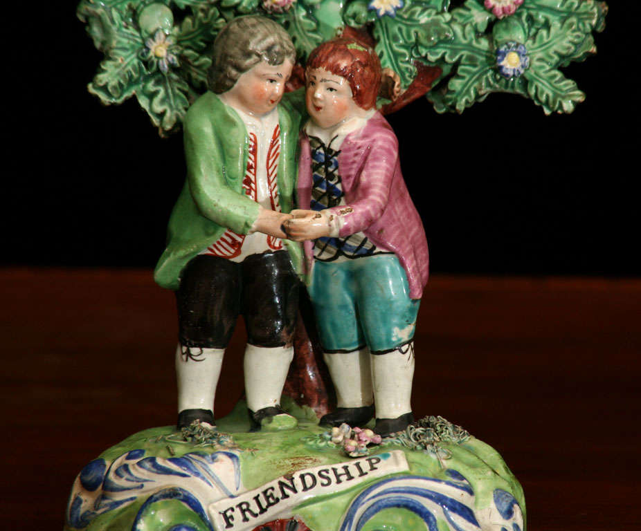 A charming little group of two young boys representing friendship by Walton Pottery of Burslem, England.
